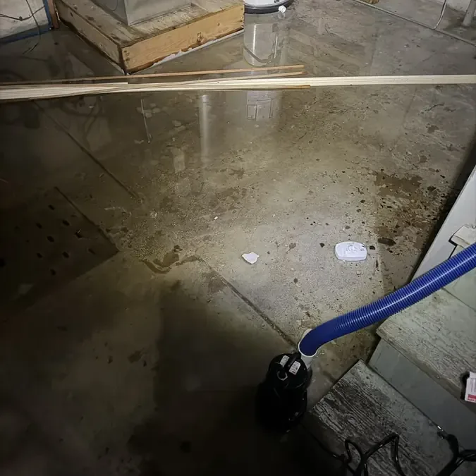 Leak from a corroded pipe traced at the base of a wall